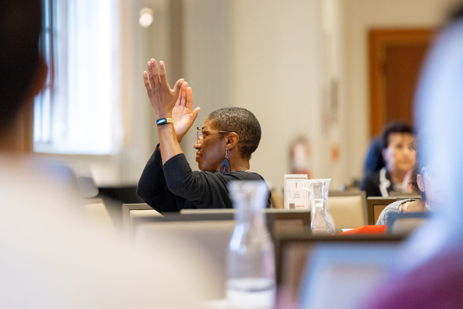 Person clapping for returning adult students.